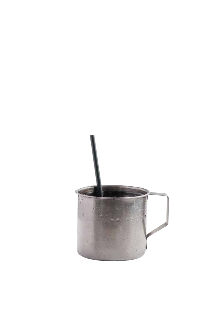 Teh O in a tin mug with a straw